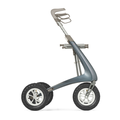 The ByACRE Carbon Overland All-Terrain Rollator, a sleek, three-wheeled gray mobility aid with large rubber tires and minimalist frame, is displayed in profile view against a white background—ideal for active adventurers.