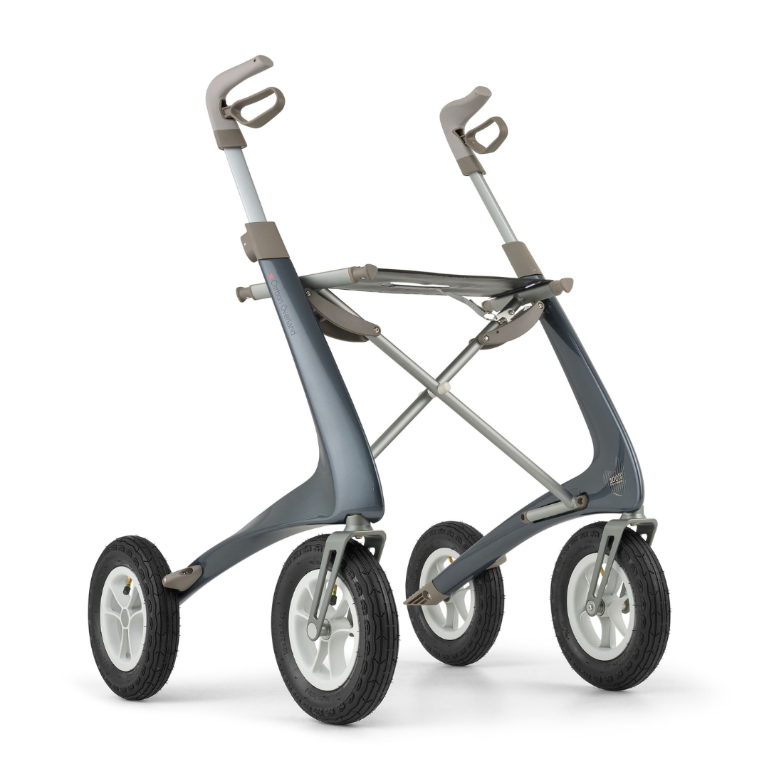 The ByACRE Carbon Overland All-Terrain Rollator features a sleek gray frame, angled handles, and large rubber tires—delivering stability and support for active walking adventures.