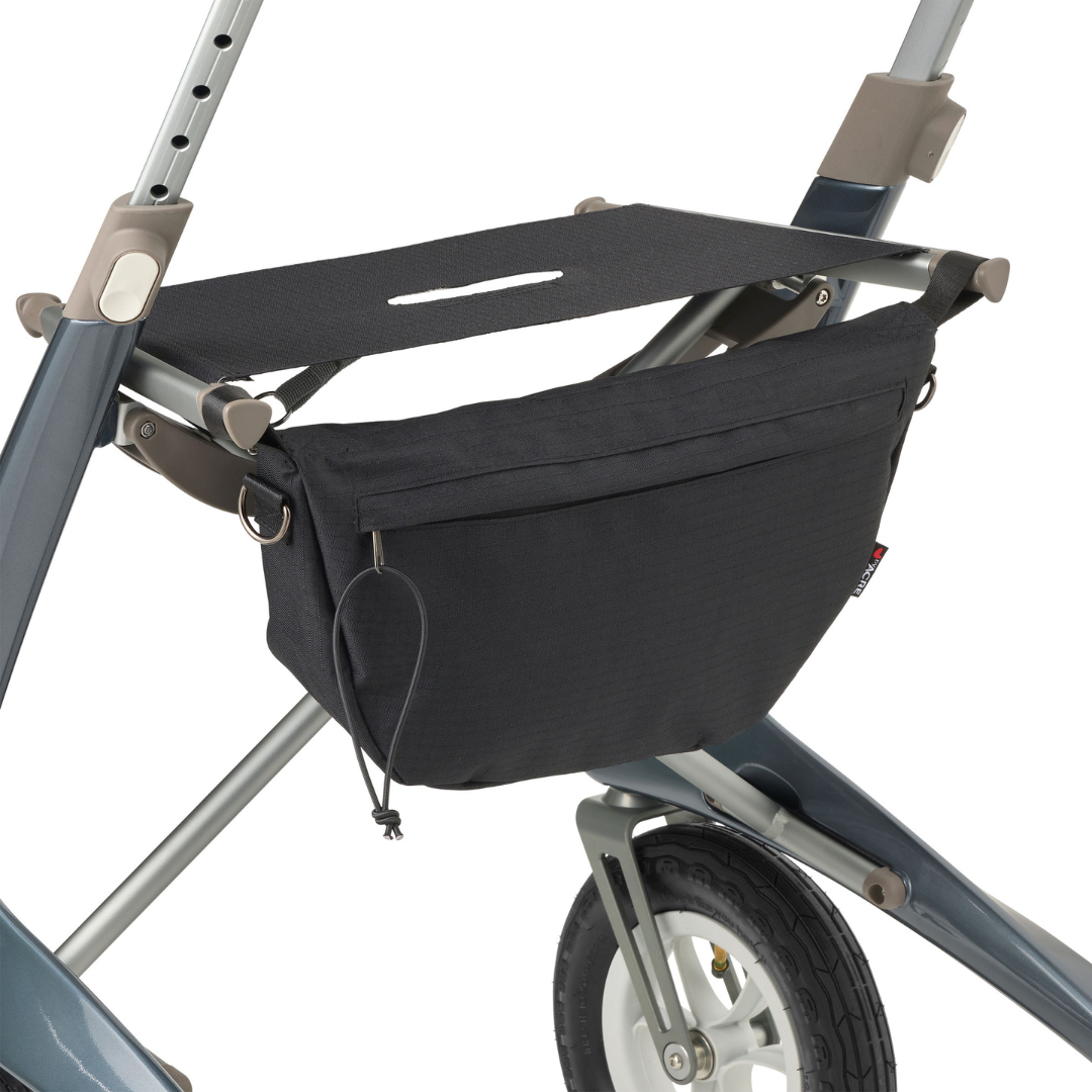 Close-up of the black storage bag on the ByACRE Carbon Overland All-Terrain Rollator, attached above the front wheel with zipper closure and pull cord—ideal for keeping your adventure essentials easily accessible.