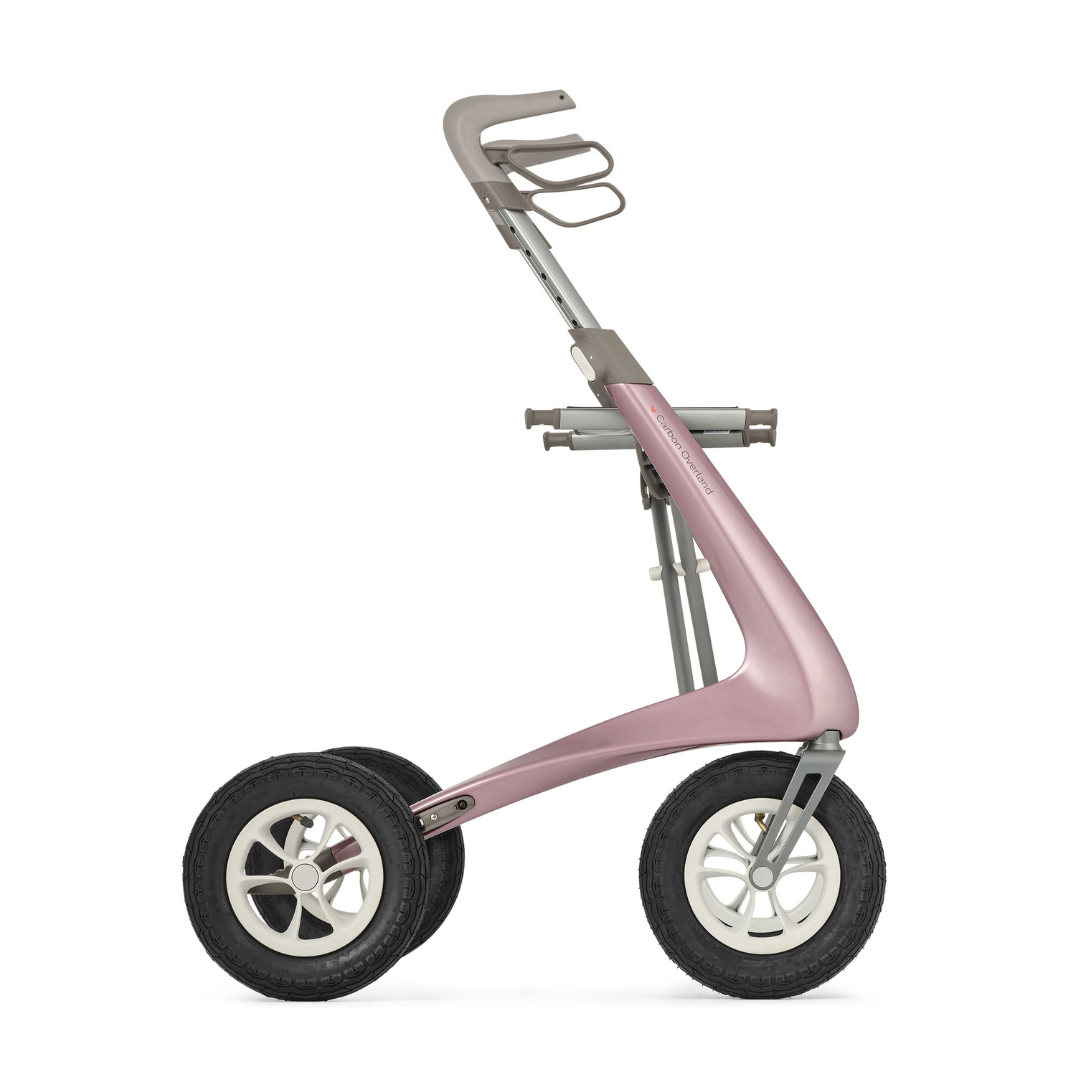 The ByACRE Carbon Overland All-Terrain Rollator, shown in profile against a white background, features a modern pink and gray design, three large black wheels, and a minimalist handle—perfect as your adventure companion.