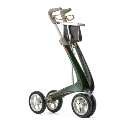 The ByACRE Ultralight Carbon Fiber Rollator (10.6 lbs) features a modern green frame, beige handles, black seat, large wheels for stability, and a front pouch. It’s four-wheeled and foldable for easy transport.