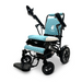 The ComfyGo MAJESTIC IQ-8000 Remote Controlled Lightweight Electric Wheelchair exudes comfort with its black and blue design featuring thickly padded, quilted upholstery. Ideal for travel, it includes an adjustable headrest, footrest, and armrests, complemented by large rear wheels and small front wheels. The Majestic brand name is prominently displayed on its lightweight frame.