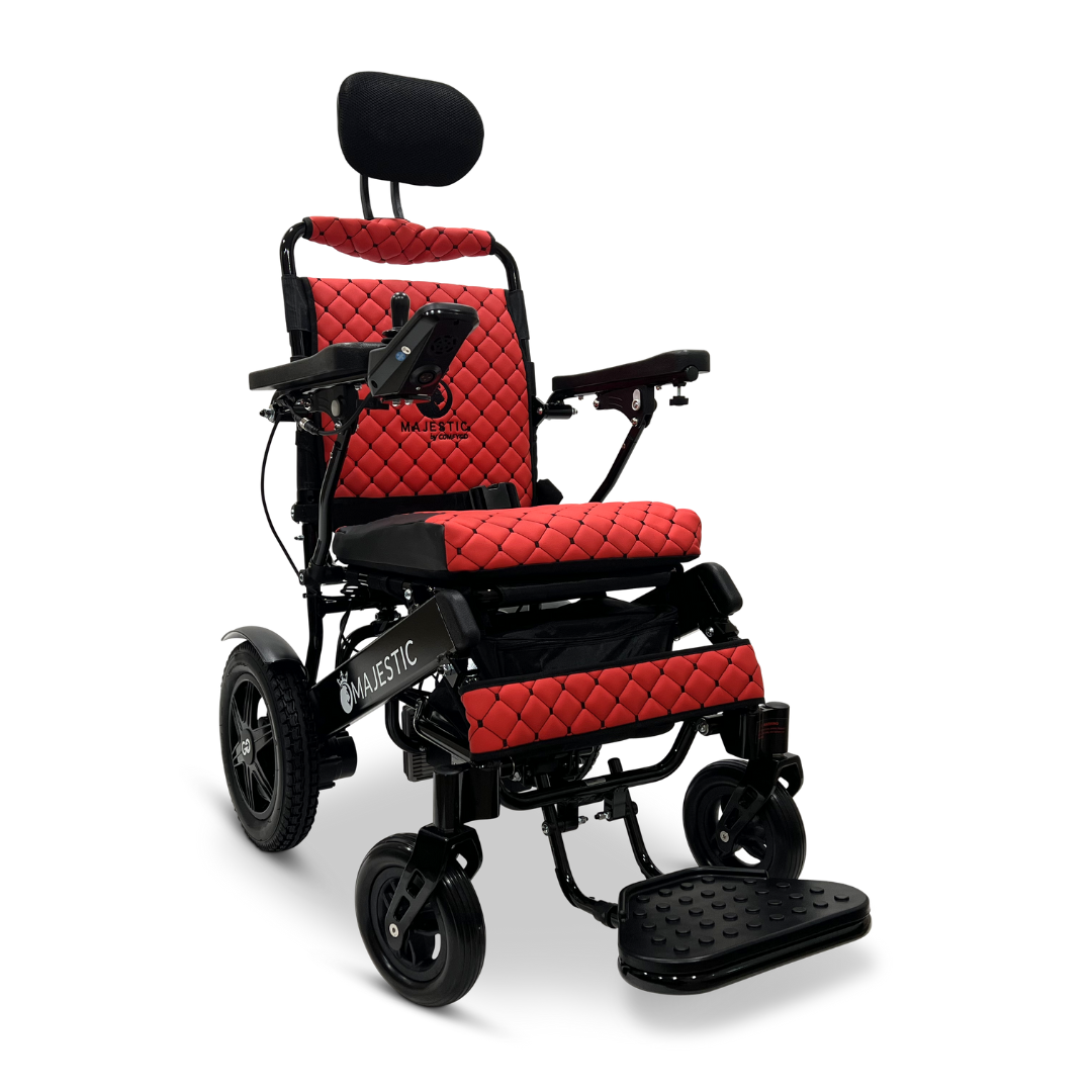 The ComfyGo MAJESTIC IQ-9000 Auto Recline Remote Controlled Electric Wheelchair, featuring a bold red and black design with a quilted pattern, includes a digital joystick controller, headrest, armrests, and footplate. It is powered by brushless silent motors and proudly displays the Majestic brand on its frame and seat.