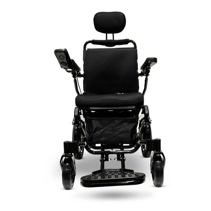 Front view of the ComfyGo MAJESTIC IQ-9000 Auto Recline Remote Controlled Electric Wheelchair, a sleek black motorized marvel featuring brushless silent motors. It offers a cushioned seat, backrest, headrest, and armrests for comfort. The digital joystick controller is conveniently located on the armrest and footplate, showcasing its expert design for mobility assistance.