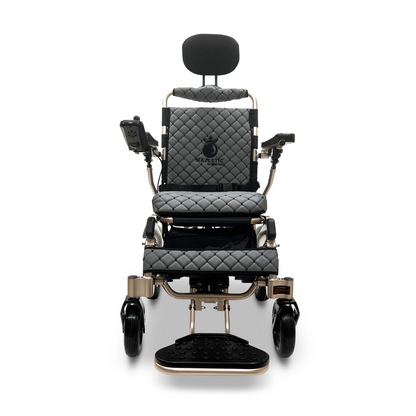 The ComfyGo MAJESTIC IQ-9000 Auto Recline Remote Controlled Electric Wheelchair features a sophisticated black quilted seat and backrest, along with a headrest, armrests, and footrest. It includes a digital joystick controller positioned on the right armrest and is equipped with brushless silent motors for a compact and stylish design.
