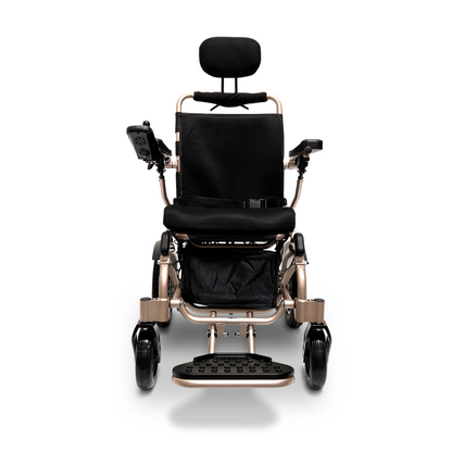 A front view of the ComfyGo MAJESTIC IQ-9000 Auto Recline Remote Controlled Electric Wheelchair highlights its contemporary design, complete with a black seat, headrest, and armrests. It is equipped with a digital joystick controller on the right armrest, brushless silent motors for ultra-quiet performance, and large rear wheels engineered for enhanced mobility and comfort.