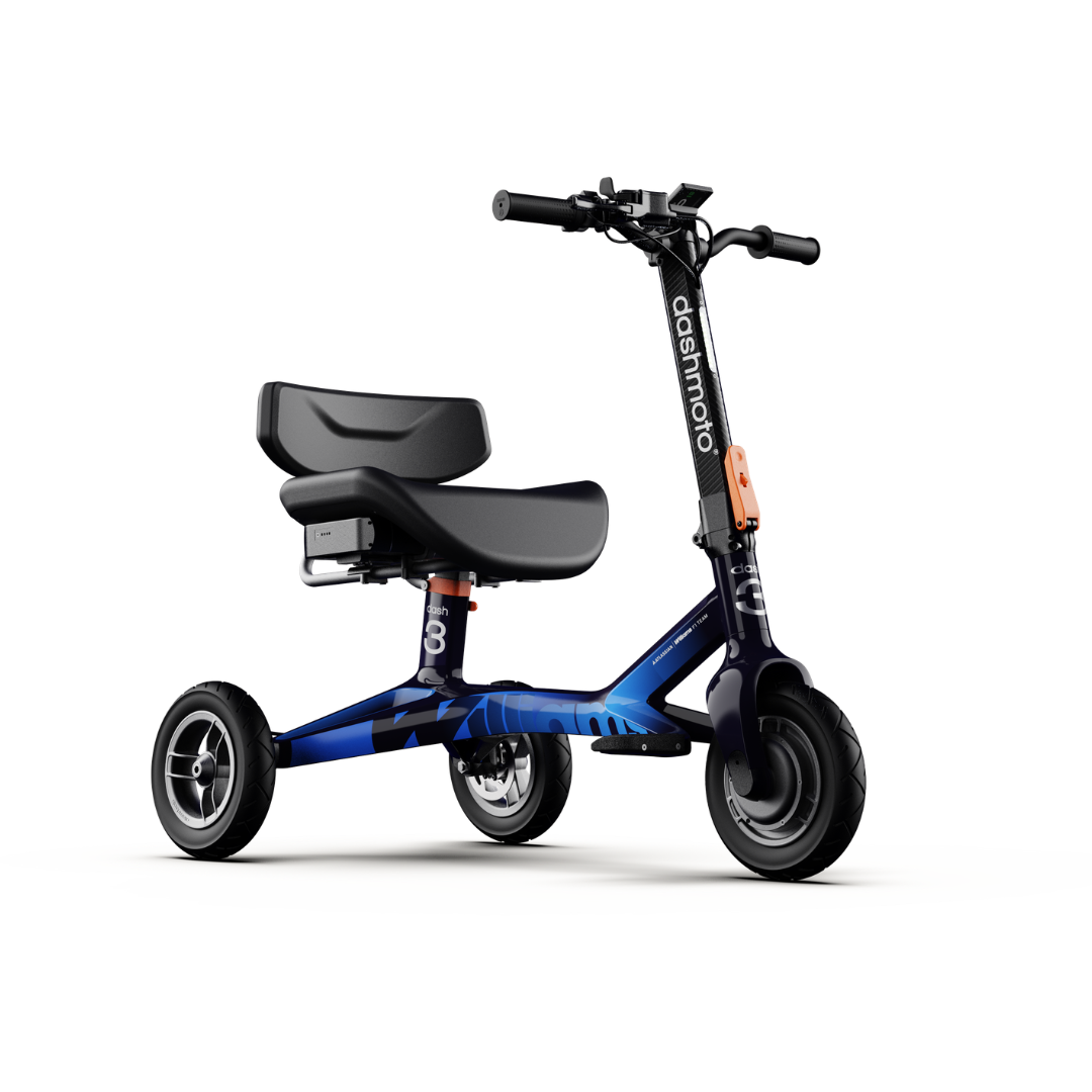 The dashmoto® dash 3 Williams Carbon Fiber Scooter is a compact, three-wheeled electric scooter with a black seat, low handlebars, and blue frame accents. "dashmoto" is printed on the stem. Shown on a white background. See specs for details.
