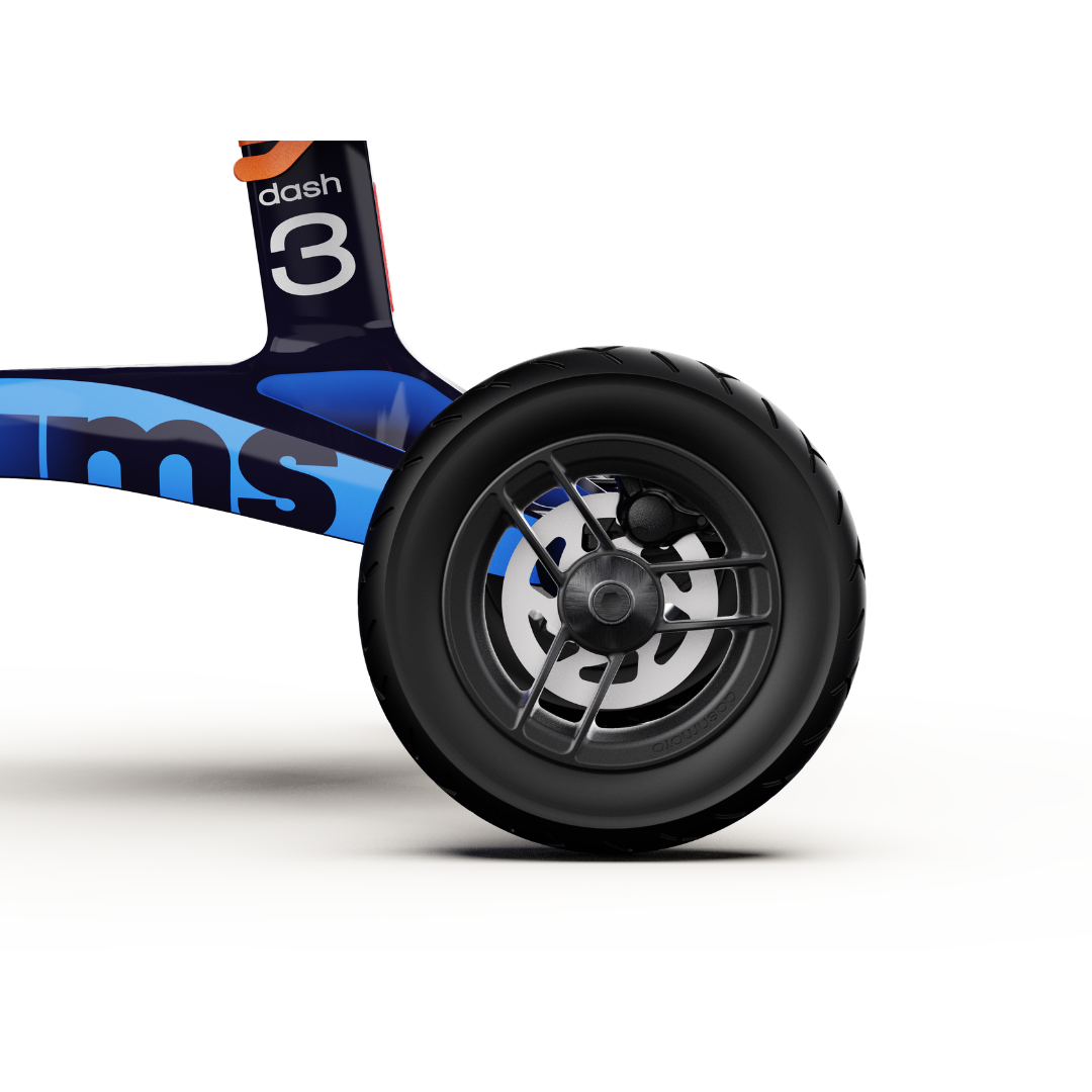 Close-up of a black rubber wheel attached to the blue dashmoto® dash 3 Williams Carbon Fiber Scooter frame, with "3" and "dash" visible, highlighting key specs against a white background.