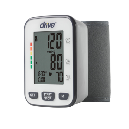 The Drive Deluxe Automatic Wrist Blood Pressure Monitor shows a 120/80 mmHg reading with a pulse of 70. The white device includes a gray cuff and front buttons: SET, START/STOP, and M.