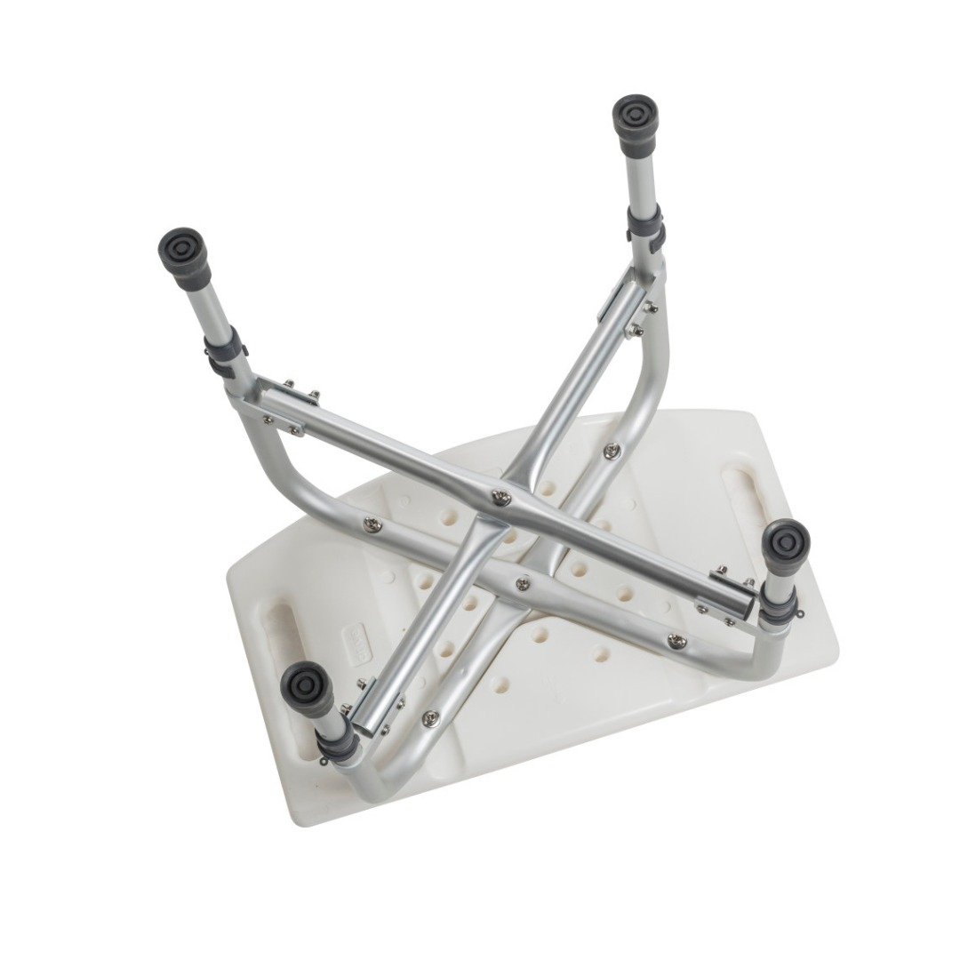 The Drive Deluxe Bariatric Shower Chair with Cross-Frame Brace is shown upside down, featuring sturdy adjustable metal legs and handles on each end for reliable support.