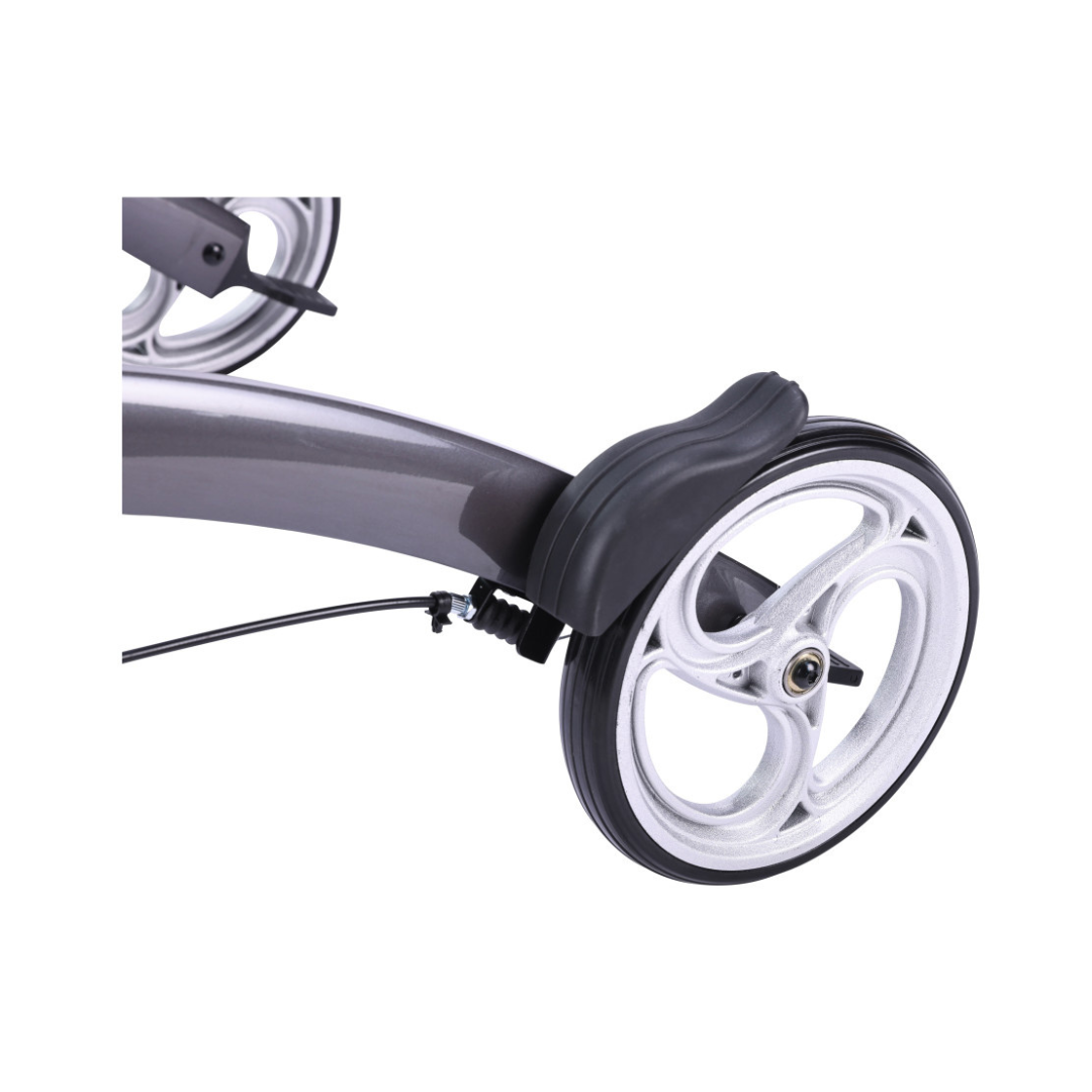 Close-up of the Drive Elevate Folding Upright Rolling Walker’s wheel, featuring a black fender, visible brake cable on the gray frame, a silver rim with three spokes, and adjustable handles for customized comfort.