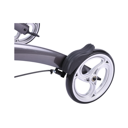 Close-up of the Drive Elevate Folding Upright Rolling Walker’s wheel, featuring a black fender, visible brake cable on the gray frame, a silver rim with three spokes, and adjustable handles for customized comfort.