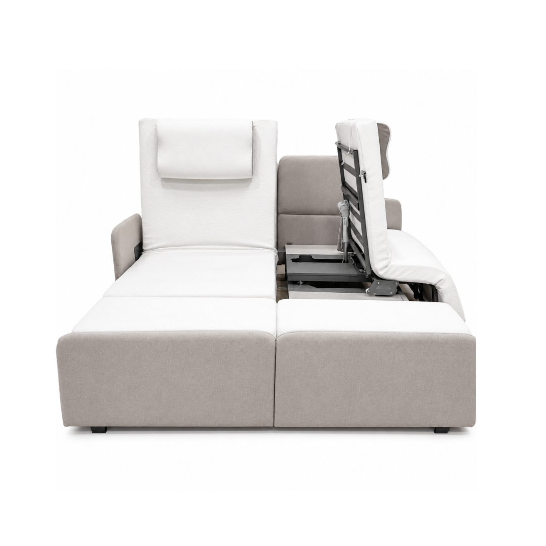 A modern sectional sofa in light gray and white features a raised backrest with an adjustable mechanism, echoing the innovative comfort of the Elevra Deluxe Rotating Lift Assist Bed - Dual King, shown on a white background.