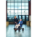 Man and woman at the airport using the Golden Tech Stride Folding Lightweight Powerchair