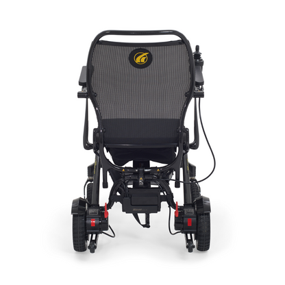 Rear view of the Golden Tech Carbon Fiber Cricket Power Wheelchair, weighing only 33 lbs. It features a mesh backrest, two large rear wheels, two smaller front wheels, a control joystick on one armrest, and a sleek modern design with a durable carbon fiber frame.