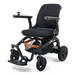 The Golden Tech Ally Folding Power Wheelchair features a modern, lightweight design with a black frame and seat. With four wheels, joystick control on the right armrest, foot support, and compact build, it’s an ideal travel companion for indoor/outdoor use. Includes mobile app control.