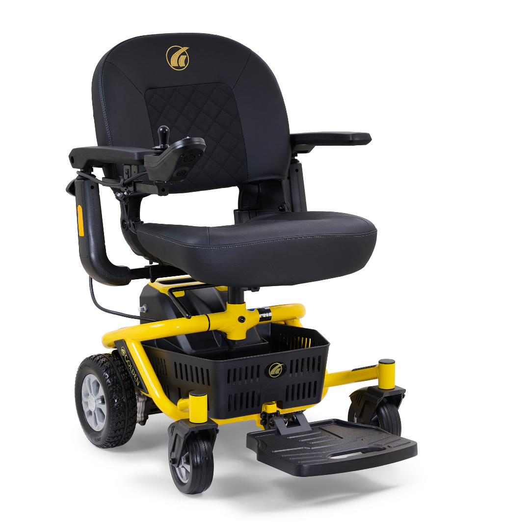 The Golden Tech GP162 LiteRider Envy Portable Power Chair is a compact, portable mobility aid with a black cushioned seat, yellow frame, armrests, joystick control, footrest, underseat basket, and large rear and smaller front wheels.
