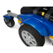 Close-up of a blue Golden Tech GP605 Companion Sport Powerchair featuring black wheels, gray hubcaps, and a Golden Compass Sport label. It showcases yellow details, a gray front fender, and includes a small black steering handle for agile movement.