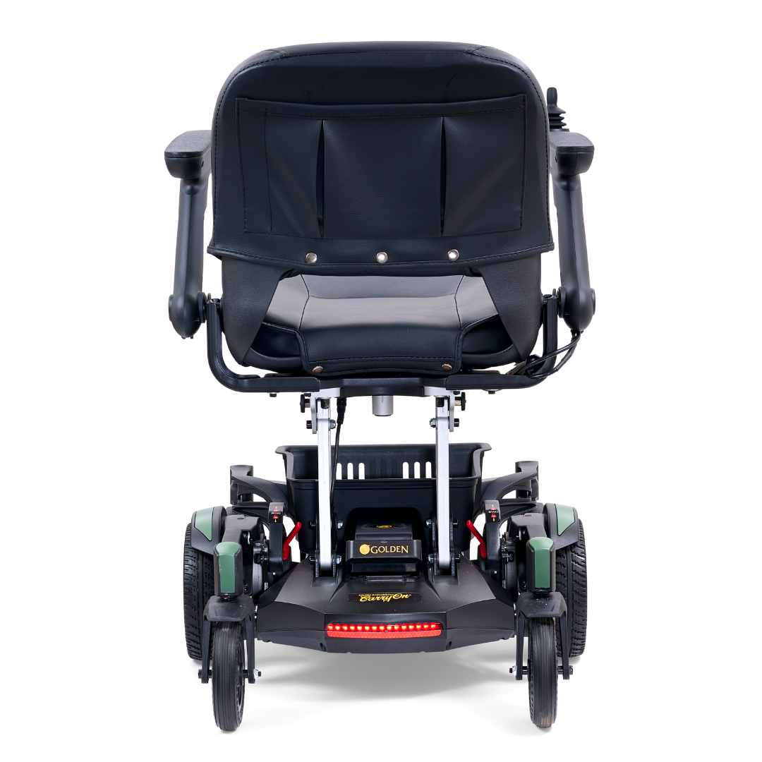 The Golden Tech GP130 Buzzaround CarryOn Portable Powerchair is ultra-compact in black and green, featuring a cushioned seat, armrests, and center wheel drive. Its folding design reveals the electric controls and battery compartment under the seat.