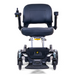 The stylish Golden Tech GP130 Buzzaround CarryOn is a black motorized wheelchair featuring a padded seat, armrests, joystick control on the right, ultra-compact four-wheel suspension, and modern design. It is depicted folded from the front against a white background.