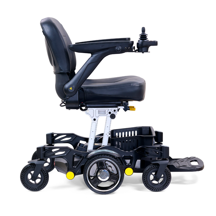 The Golden Tech GP130 Buzzaround CarryOn Portable Powerchair is an ultra-compact, sleek black folding wheelchair with joystick controls on the right armrest. It features a cushioned seat and backrest, a storage basket below, four suspension wheels, a footrest, and a modern design.