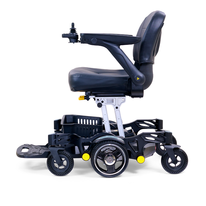 The Golden Tech GP130 Buzzaround CarryOn Portable Powerchair, in sleek black and silver, showcases a side view with a cushioned seat, armrests, joystick controls, large central wheels, 4-wheel suspension, and smaller front and rear wheels.