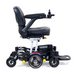 The Golden Tech GP130 Buzzaround CarryOn Portable Powerchair offers a sleek black frame, adjustable cushioned seat, joystick control, and durable wheels. Experience enhanced mobility with ultra-compact maneuverability and 4-wheel suspension for a smoother ride.