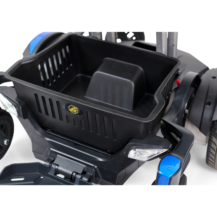 Close-up of a black basket on the Golden Tech GP130 Buzzaround CarryOn Portable Powerchair. The basket features ventilated sides with a logo, while the powerchair boasts a robust frame, 4-wheel suspension, large wheels, and blue details.