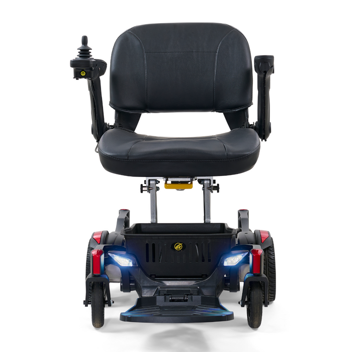The Golden Tech GP130 Buzzaround CarryOn Portable Powerchair showcases a front view with a black cushioned seat, armrests, and a right-hand joystick. It features four wheels, LED lights on the front pair, and is designed for personal transportation and accessibility.
