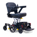 The Golden Tech GP130 Buzzaround CarryOn Portable Powerchair features a black cushioned seat, right-arm joystick control, ultra-compact design, and 4-wheel suspension for sleek mobility. A convenient basket under the seat adds extra utility.