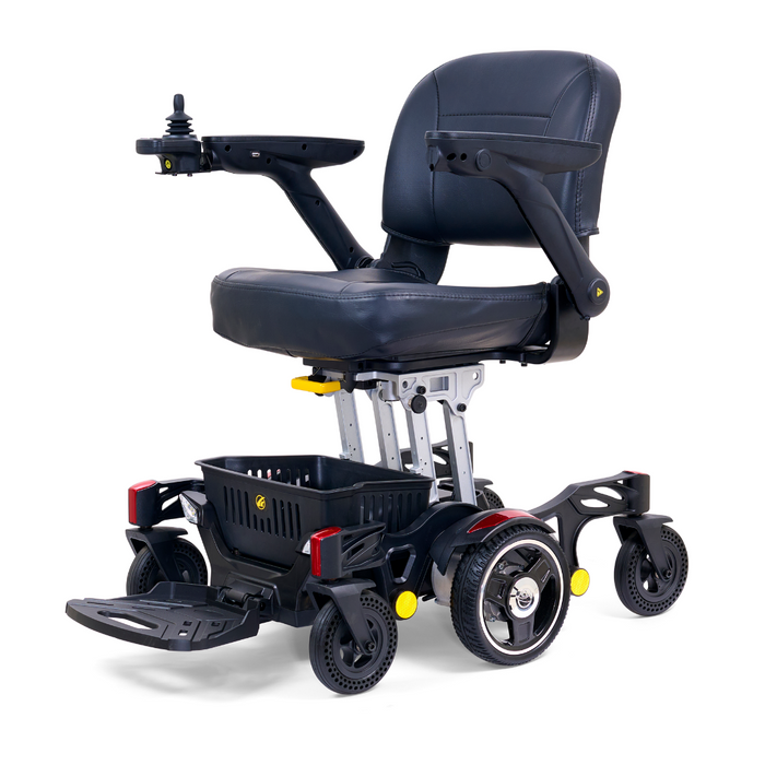 The Golden Tech GP130 Buzzaround CarryOn Portable Powerchair is an ultra-compact, black motorized wheelchair with a cushioned seat, foldable footrest, and armrests. It has 4-wheel suspension, a right-armrest joystick, and a handy storage basket below the seat for convenience.