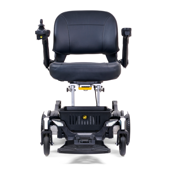 The Golden Tech GP130 Buzzaround CarryOn Portable Powerchair is ultra-compact, with a black cushioned seat and backrest, armrests, joystick control, 4-wheel suspension, front headlights, and a sleek design. Its positioned forward and ready for your journey.