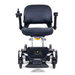 The Golden Tech GP130 Buzzaround CarryOn Portable Powerchair is ultra-compact, with a black cushioned seat and backrest, armrests, joystick control, 4-wheel suspension, front headlights, and a sleek design. Its positioned forward and ready for your journey.