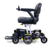 The Golden Tech GP130 Buzzaround CarryOn Portable Powerchair is a sleek, compact model in black and silver, with large wheels and joystick control. The cushioned seat and backrest enhance comfort while maintaining sturdiness, making it ideal for those seeking style and practicality.