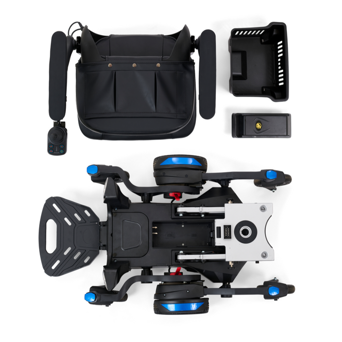 An overhead shot of the disassembled Golden Tech GP130 Buzzaround CarryOn Portable Powerchair is shown on a white background. The ultra-compact black wheelchair with blue accents features neatly arranged components: 4-wheel suspension, main frame, seat, footrest, armrests, control panel, battery, and storage basket.