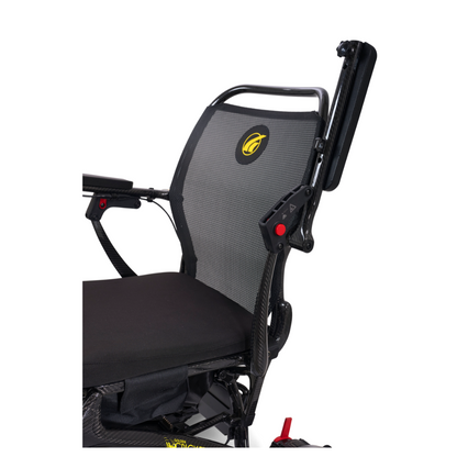 A close-up of the Golden Tech Carbon Fiber Cricket Power Wheelchair, weighing only 33 lbs, with a black mesh backrest, padded seat, yellow logo, foldable armrest, and a sleek carbon fiber minimalist design.