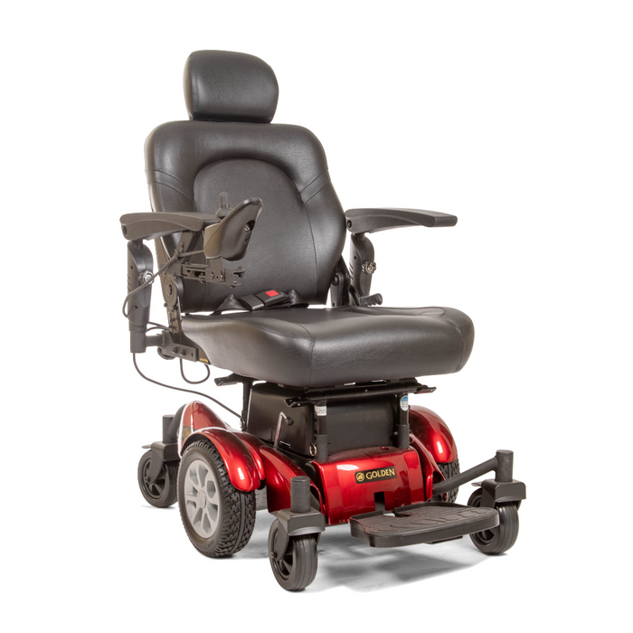 The Golden Tech GP620 Compass HD Bariatric Electric Wheelchair is a red and black chair with a cushioned seat, backrest, headrest, armrests, joystick control on its center-wheel drive platform. It features four wheels, a footrest, and the brand Golden prominently at the front.