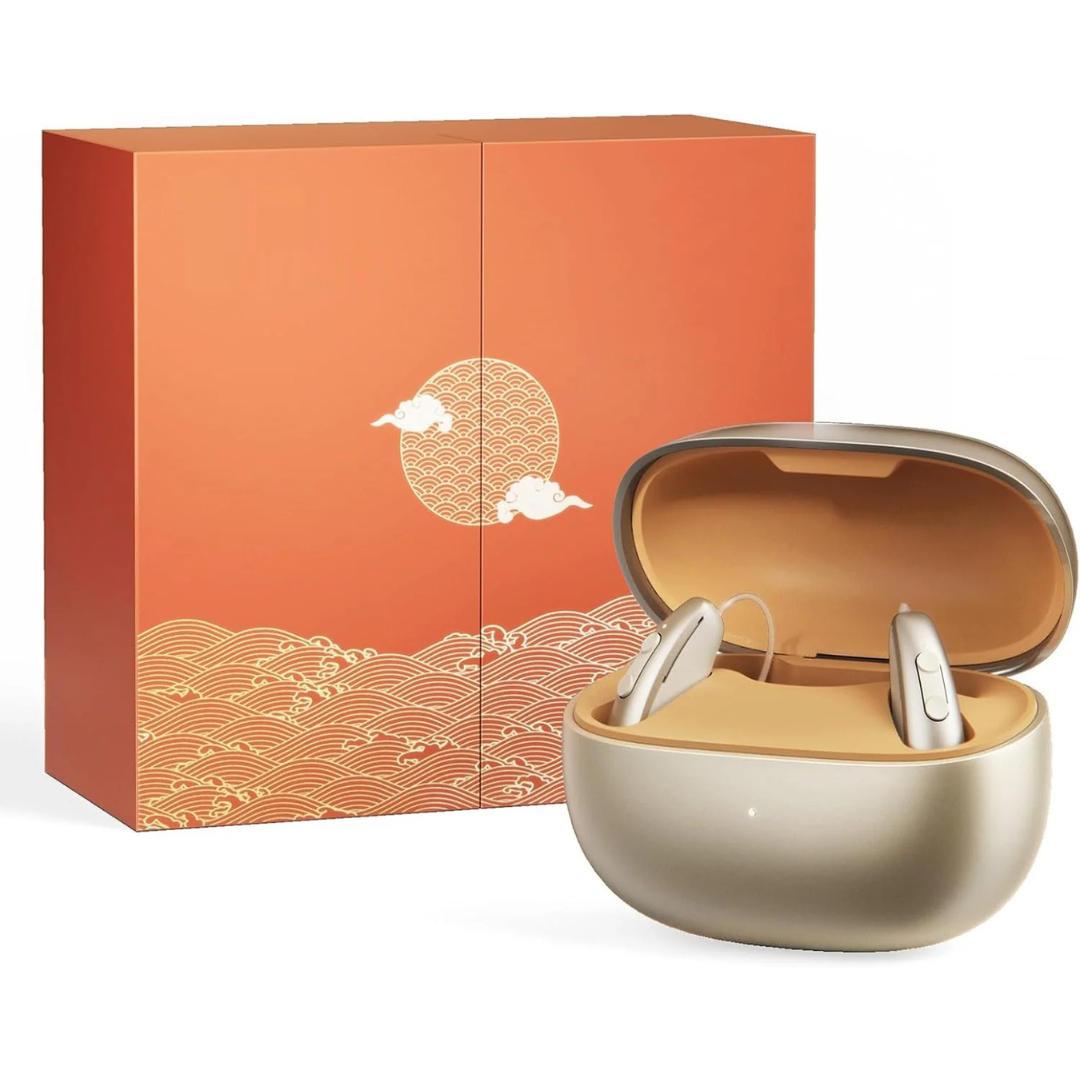 A pair of iBstone AuraLink Bluetooth Hearing Aids are in a gold charging case, set in front of an orange box featuring sun, cloud, and wave designs.