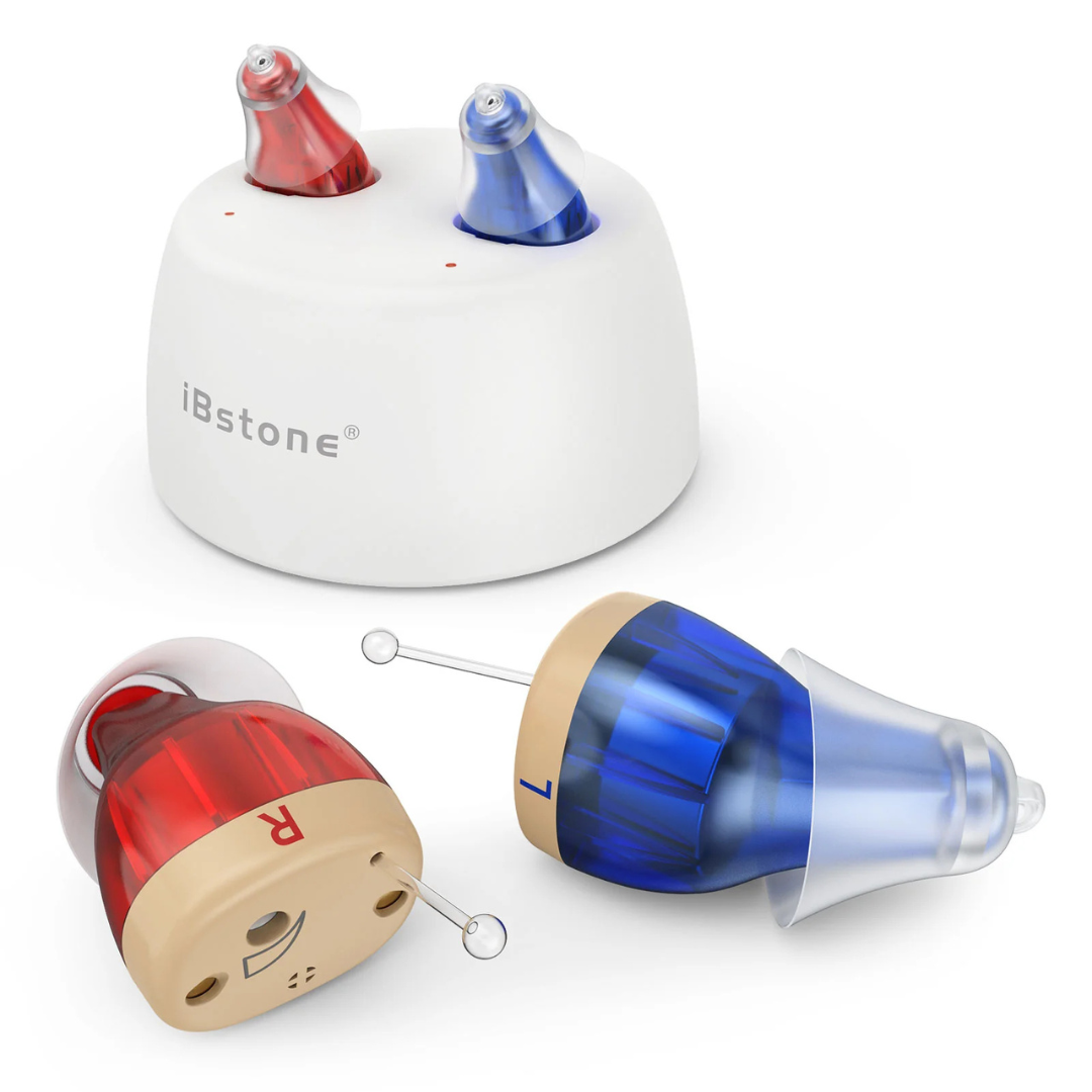 Two ultra-compact iBstone K17 Rechargeable CIC Hearing Aids, labeled L (blue) and R (red), rest on a white charging base. Each features a clear tip for easy insertion.