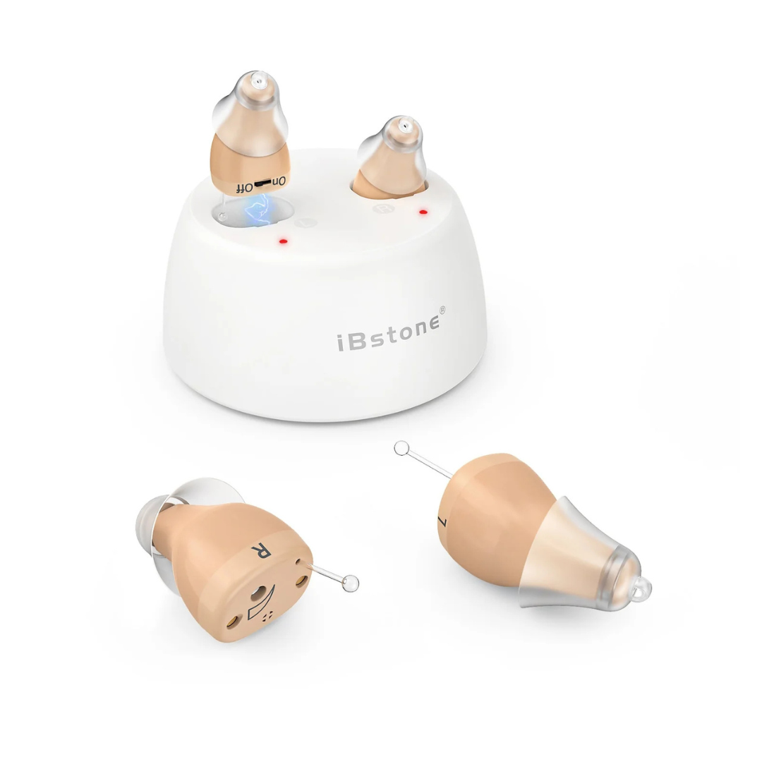 A pair of beige iBstone K19 Rechargeable CIC Hearing Aids labeled L and R, with clear tips, are shown inside and outside a white charging case featuring indicator lights and on/off labels.