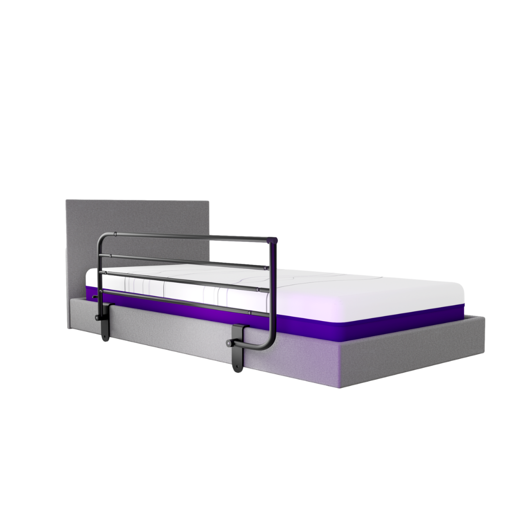 A single bed with a grey headboard and base, a white and purple mattress, and the iCare Medical Bed Safety Rails for bedside support and fall prevention. The background is plain white.