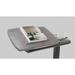 The iCare Medical Over Bed Tilting Table, shown with a book on a stand and a white cup, features convenient height adjustability. Set against a plain gray background, this table is perfect for use over beds or chairs.