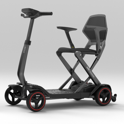 An iMOVE AirCarbon Folding Carbon Fiber Scooter in black with a backrest, armrests, and four wheels with red rims.