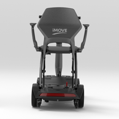 Rear view of an iMOVE AirCarbon Folding Carbon Fiber Scooter featuring a high backrest, armrests, and a red taillight.