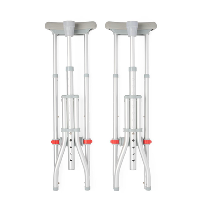 The Medline Universal Folding Crutches feature gray handles and underarm pads with red and gray adjustment mechanisms for easy customization.