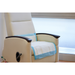 A beige medical recliner with wooden armrests is covered by a Medline Protection Plus Disposable Underpad, featuring blue and white colors and polypropylene backing for moisture protection, positioned by a frosted window in a healthcare setting.