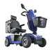 The Metro Mobility S500 Heavy Duty Scooter in blue features a cushioned seat, handlebars, and front basket. Its sturdy design includes a backrest for comfort, promoting social independence with modern branding.