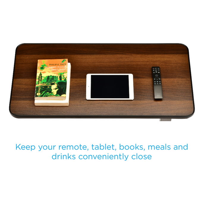 The Nova Medical Rolling Overbed Table with Tilting Tray, made of wood and adjustable in height, holds a book, tablet, or remote. The phrase Keep your remote, tablet, books, meals and drinks conveniently close is displayed on a white background.