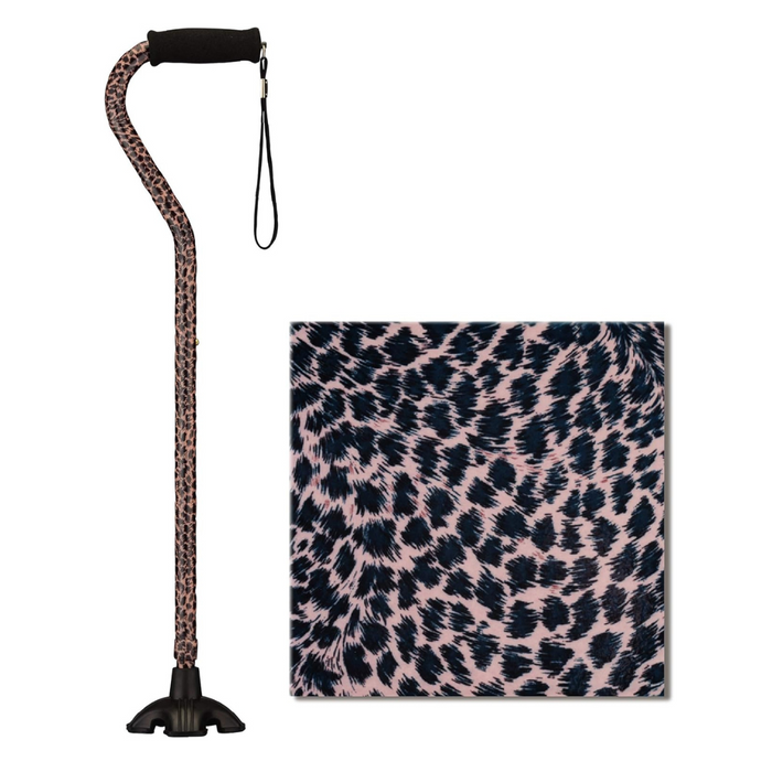 The Nova Medical Stand Alone SugarCane with Quad Tip features a leopard print design and a comfortable black handle. Its sturdy rubber base ensures stability, while the chic leopard pattern with pink and black spots adds stylish flair to your walk.