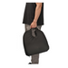 A person in a black shirt and gray pants holds a Nova Medical Happy Collection Back and Lumbar Support Gel Cushion with a handle against a plain white background.